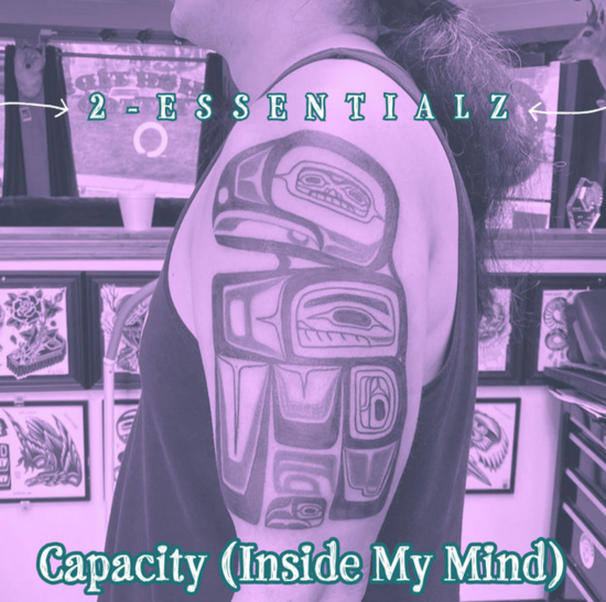 Album art of 2essentialz single Capacity (inside my mind) image of 2essentialz standing side ways showing his tattoo